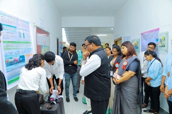The Secretary inspecting entries at the State-Level Poster Presentation Program